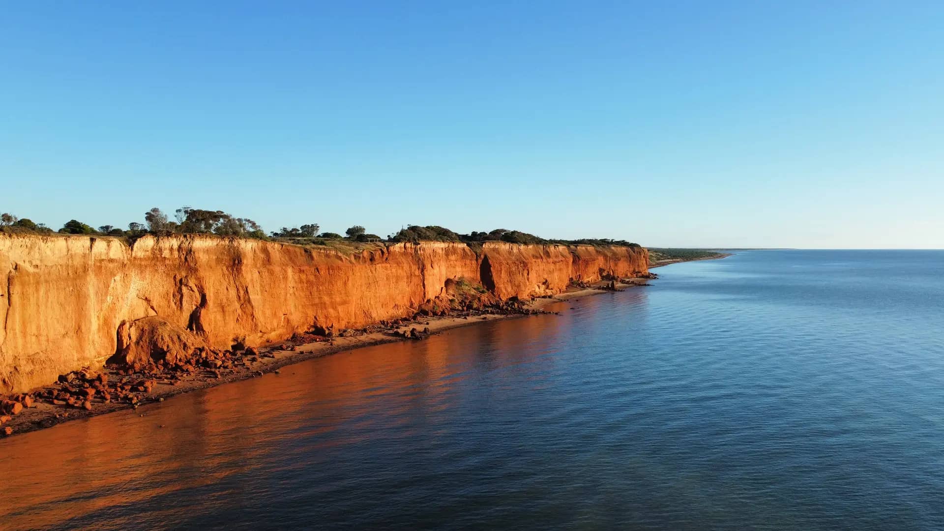 Red cliffs and blue water along the Ardrossan coastline of the Yorke Peninsula