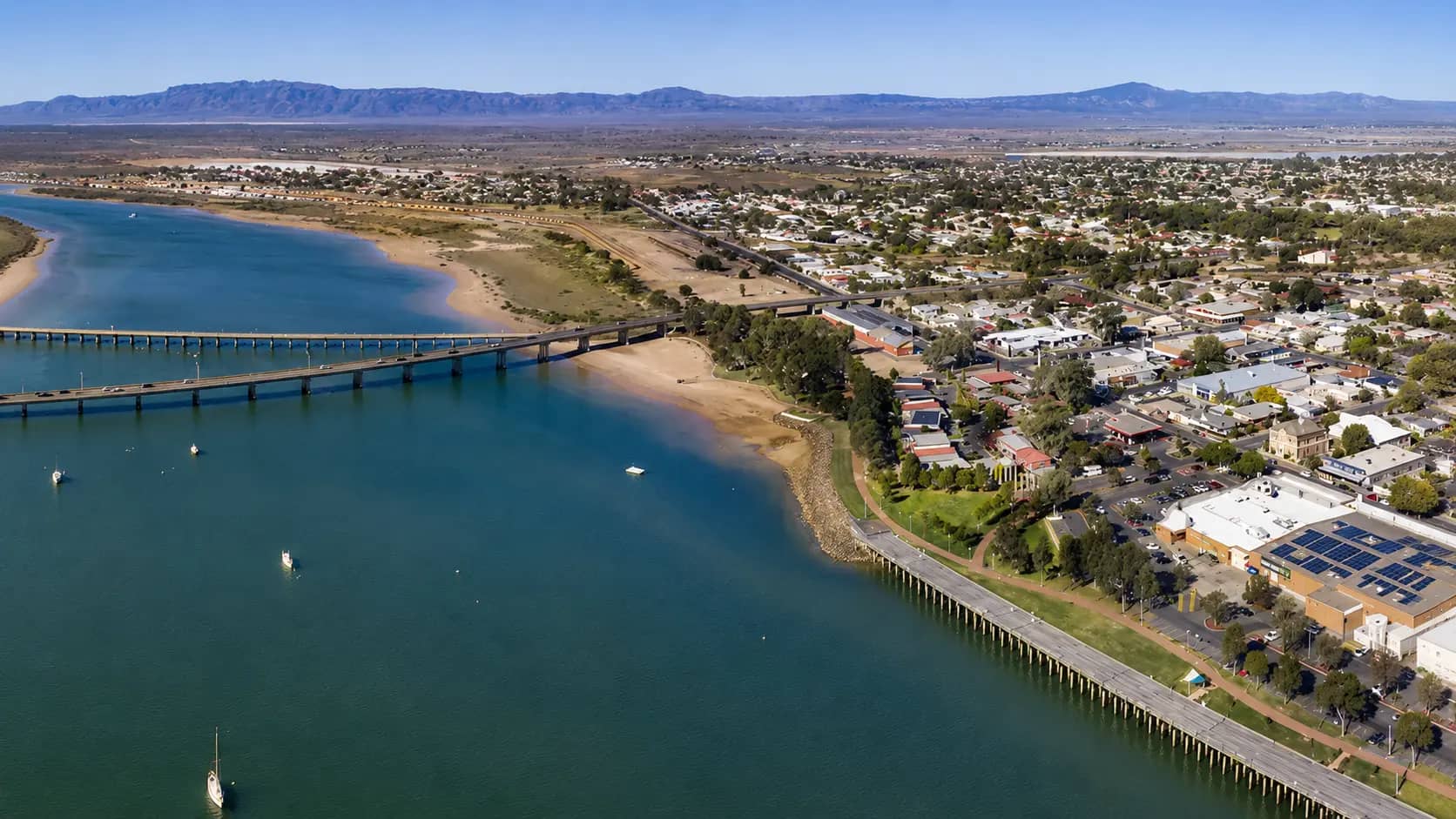 A view across Port Augusta toward the Joy Baluch AM Bridge, with the residential streets where most of the FIFO and shift-work households I work live